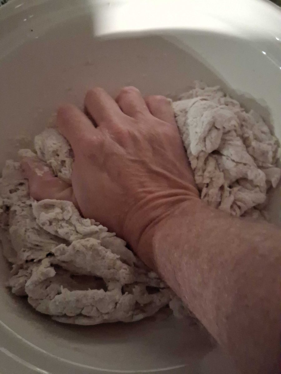 Working the shaggy mass by hand